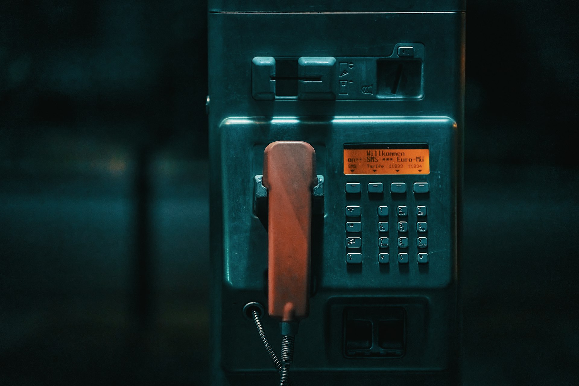 A close-up of a red telephone